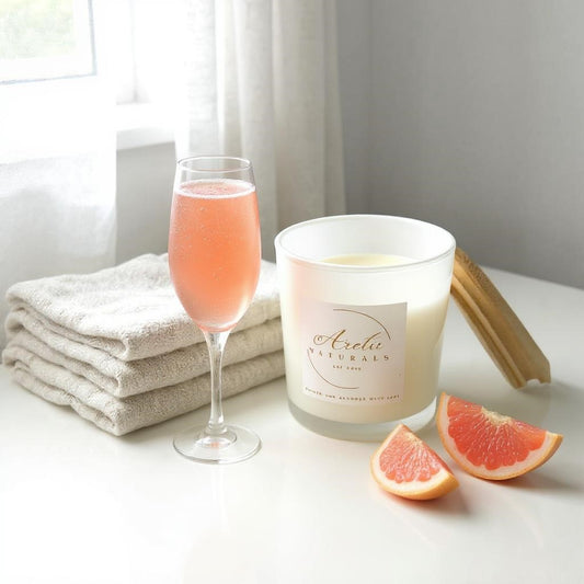 Aretii Exotic Pink Champagne coconut wax candle in white glass jar with white label and bamboo lid.