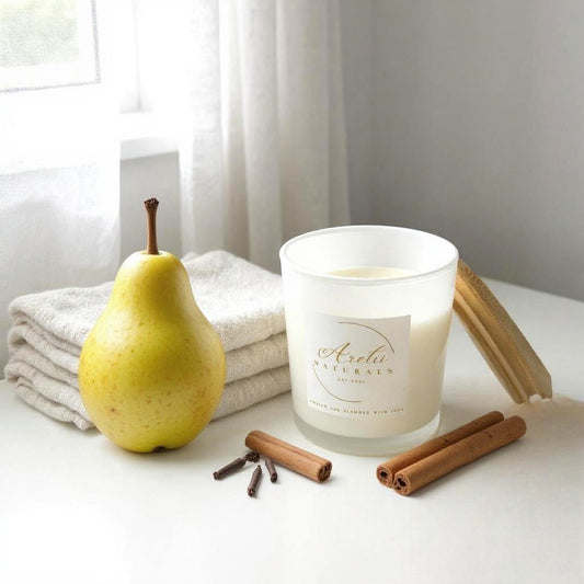 Aretii French Pear coconut wax candle in white glass jar with white label and bamboo lid.