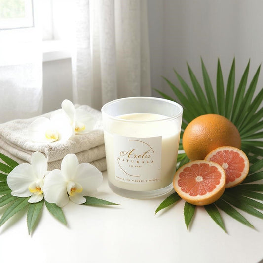 Aretii Naturals Tropical Breeze coconut wax candle in white glass jar with white label and bamboo lid.